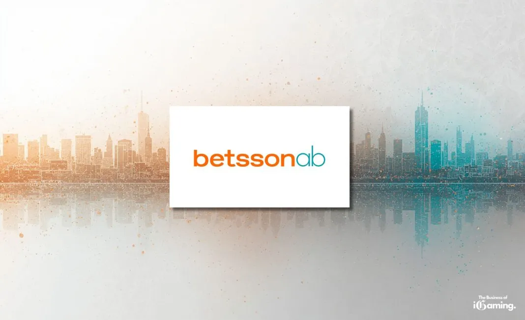 Betsson AB logo centered over split orange and teal city skyline background with The Business of iGaming branding in the corner